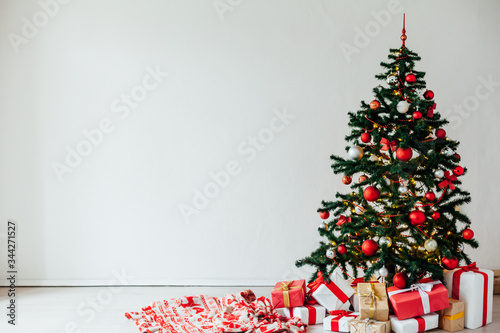 Christmas tree with gifts of red white interior decor for the new year