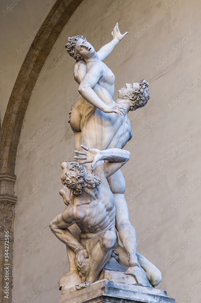 Obraz premium The Rape of the Sabine Women. White marble sculpture by Giambologna. Composition with the figura serpentina, an upward snakelike spiral movement. Piazza della Signoria, Florence, Tuscany, Italy.