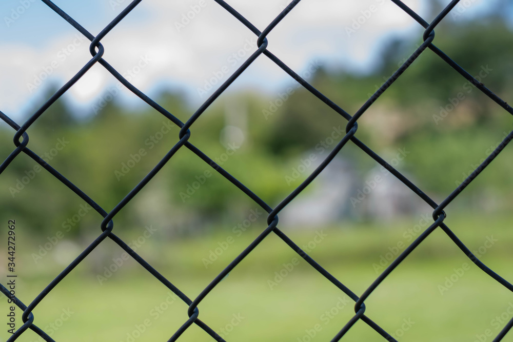 iron chain link fence against sky iron chain link fence against sky