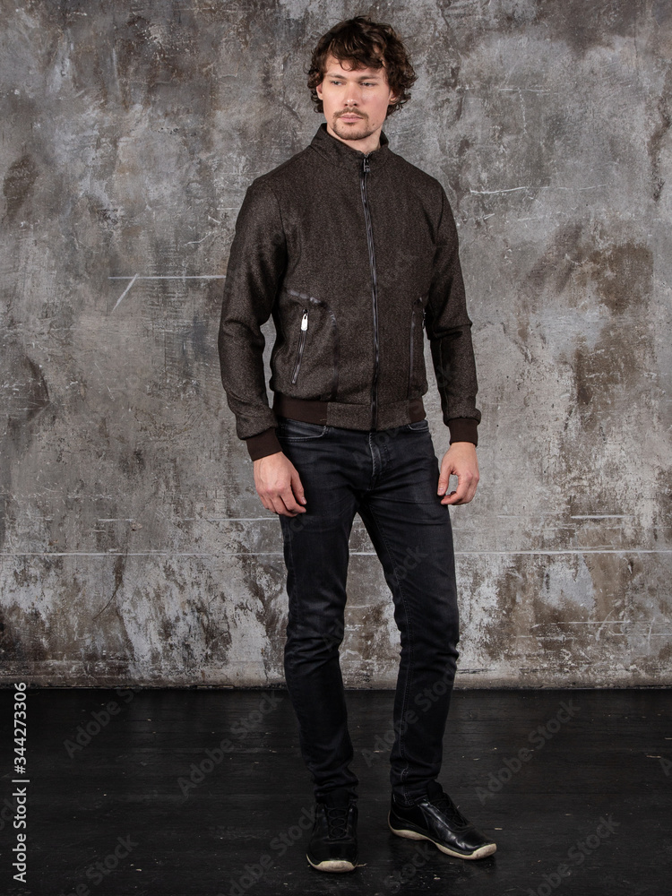 Full length studio portrait of attractive young man. Young Male Fashion Model Posing In Casual Outfit. Full length studio portrait of attractive young man. Young Male Fashion Model Posing In Casual Outfit.
