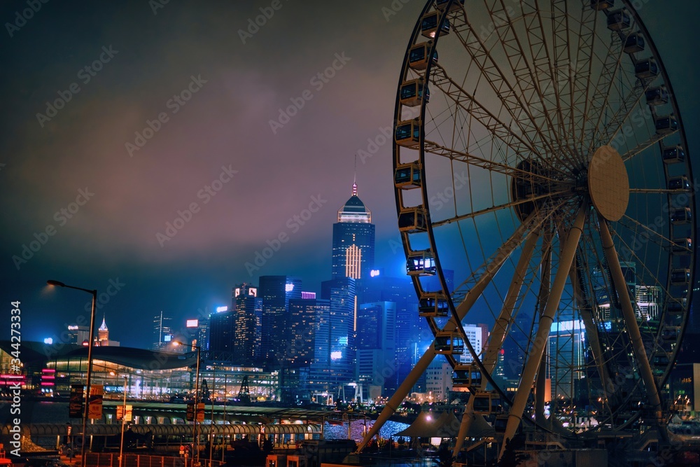 Hong Kong, China; Dic 3 2017: Skyline and Ferris wheel at night