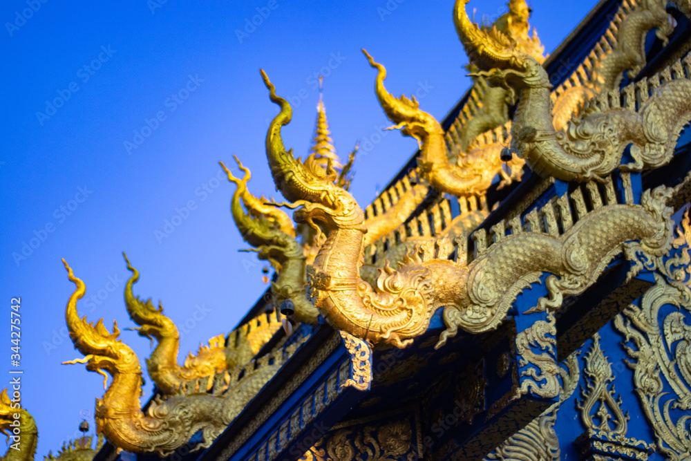 A beautiful view of Wat Rong Suea Ten, the Blue Temple at Chiang Rai, Thailand.