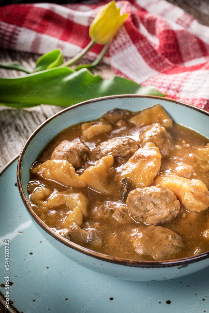 Meatballs in gravy with cast noodles. Meatballs in gravy with cast noodles.