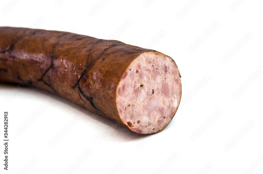 smoked sausage on a white background. Close-up. smoked sausage on a white background. Close-up.