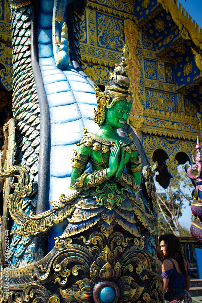 Fototapeta premium A beautiful view of Wat Rong Suea Ten, the Blue Temple at Chiang Rai, Thailand.