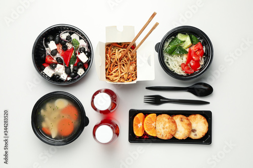 Flat lay with takeaway food on white background. Food delivery © Atlas