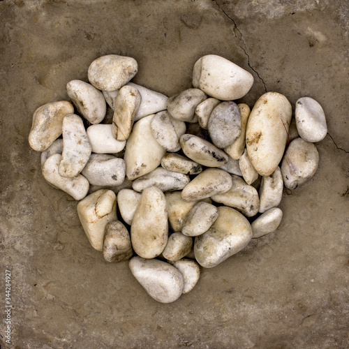 pile of stones in a heart shape neutral background