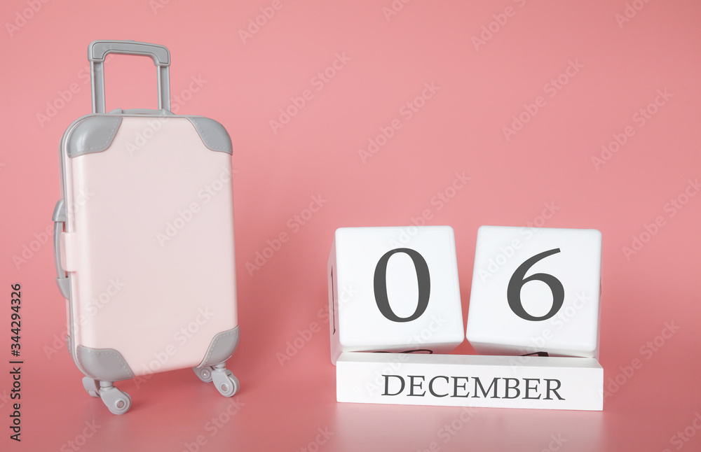 Calendar wooden cube. December 06, time for a winter holiday or travel, vacation calendar