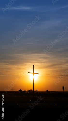 Cross silhouette at sunset.Hortobagy, Hungary.