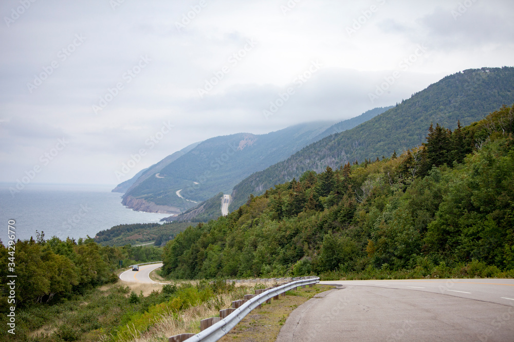 Cape Breton highway winding along the Atlantic ocean shore. Cape Breton highway winding along the Atlantic ocean shore.