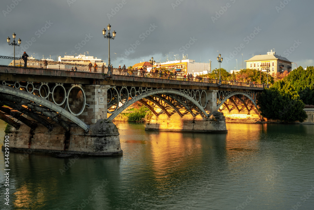 Triana Bridge in Seville, Spain at sunset