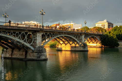 Triana Bridge in Seville, Spain at sunset