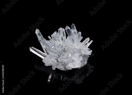 Obraz na plátne macro shot of a raw clear crystal quartz specimen on a black reflective backgrou