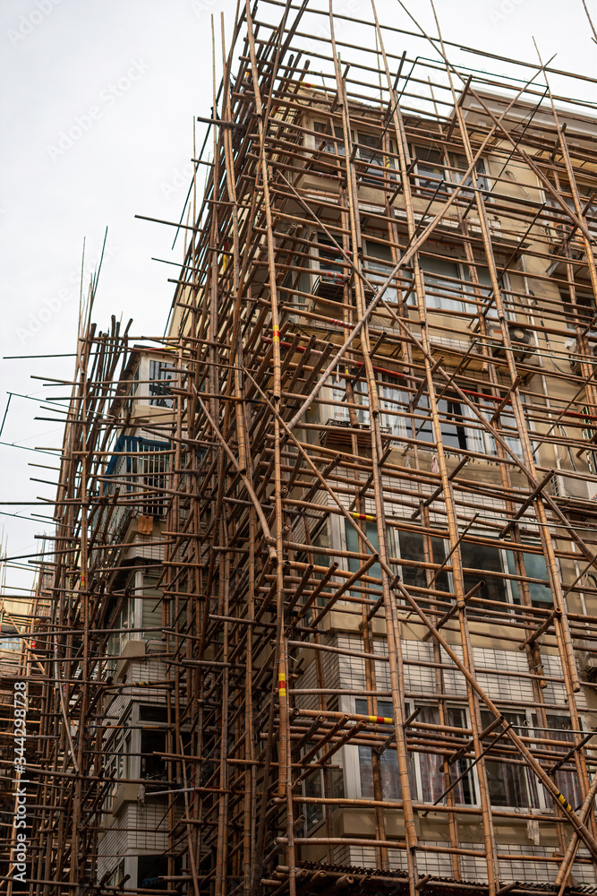 Bamboo scaffolding outside a residential building in china Bamboo scaffolding outside a residential building in china