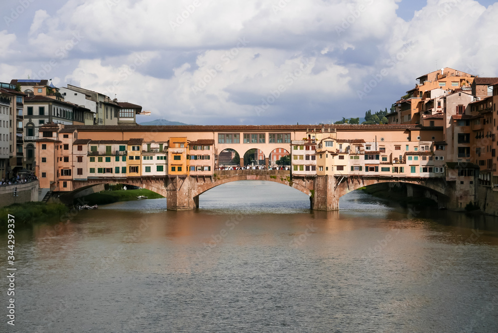 Ponte vecchio in Florence in mid summer with beautiful clouds in the sky