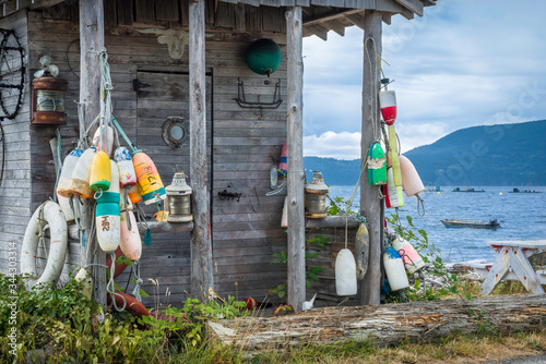 An old boathouse shack has a great view of Legoe Bay from the Lummi Island shoreline, just off the shore of northern Washington State. photo