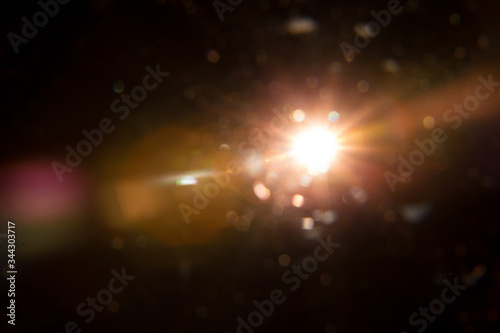 Abstract Natural Sun flare on the black background.