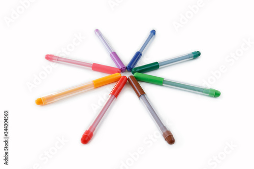 Close-up of set of colorful rainbow colored marker pens, low angle view. Isolated on white background with clipping path.