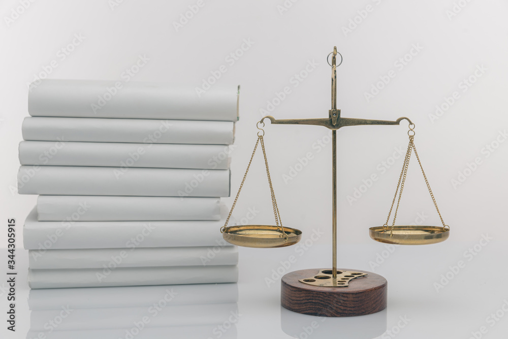 Wooden gavel with justice scales and open book, isolated on white. Wooden gavel with justice scales and open book, isolated on white.