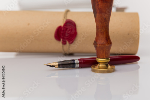 Notary's public pen and stamp on testament and last will. Notary public tools.