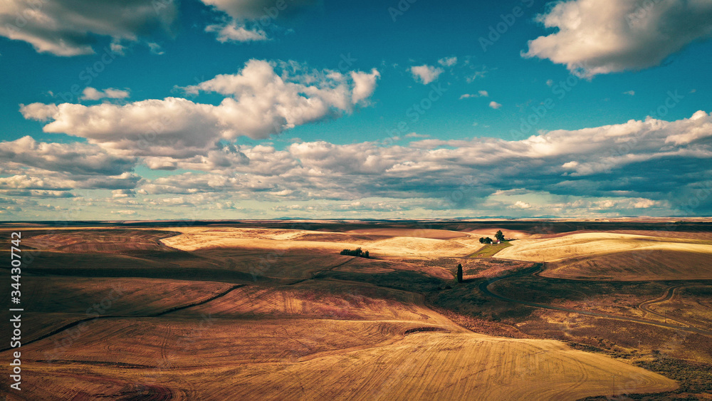Fototapeta premium Clouds over Grass Desert Western Washington State (Aerial Drone Photo)