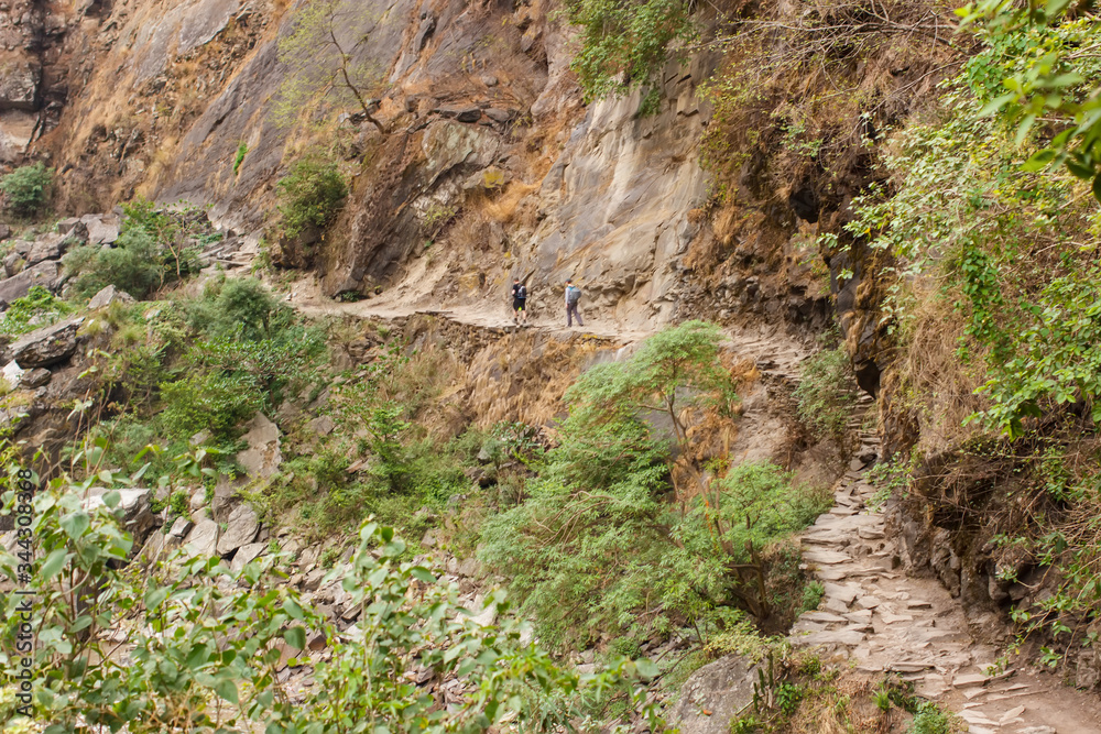Trail along the steep wall of the gorge in the Himalayas in the Manaslu region