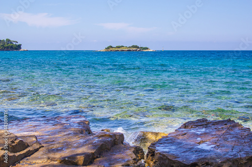 Little green island at the coast in Rovinj, Istrian Peninsula in Croatia