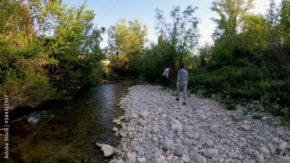 Walking along the edge of the river. Walking along the edge of the river.