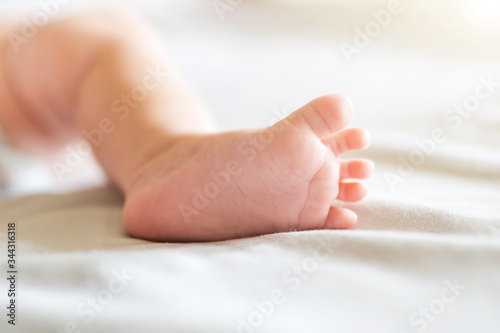 Feet of a newborn baby. Tiny baby feet .Selective focus