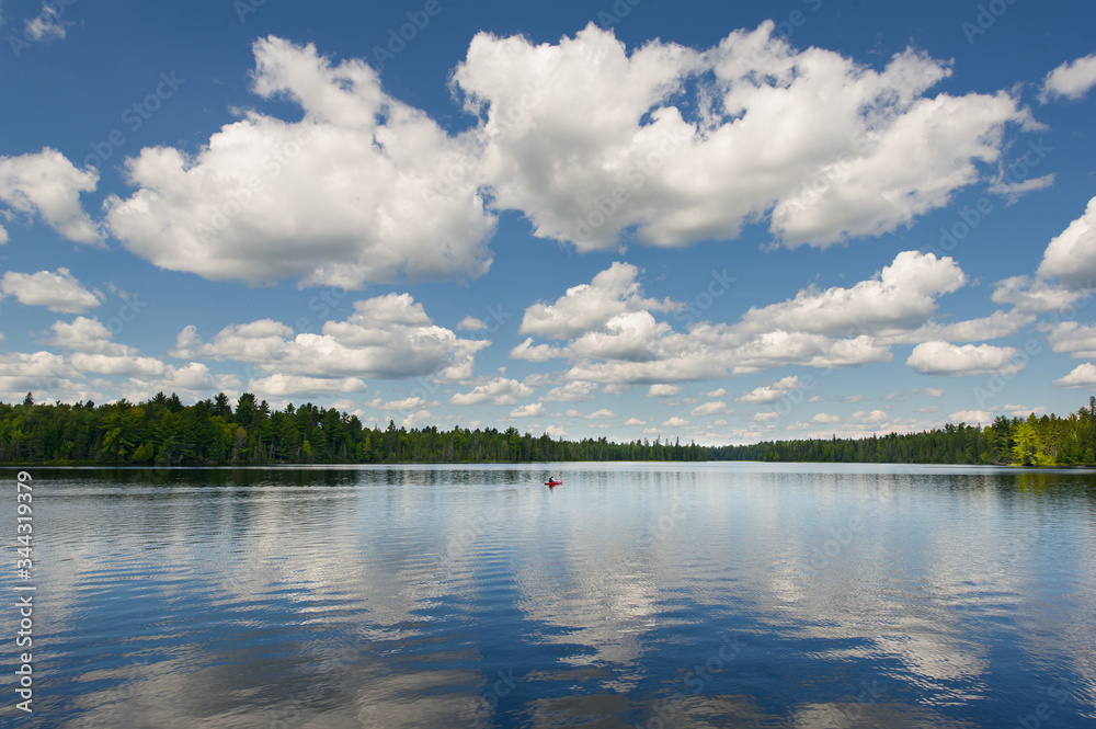 Lake view from a cottage dock in Algonquin Park, Ontario. Clouds