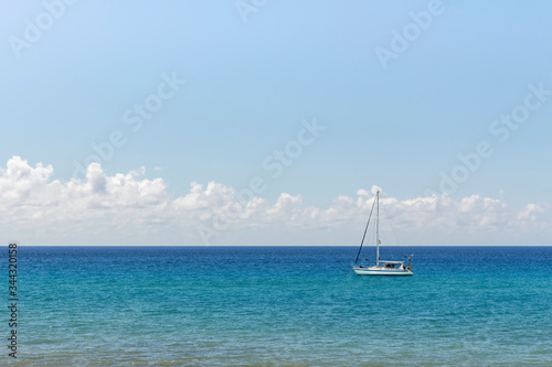 Minimalist seascape with turquoise waters and cloudy sky