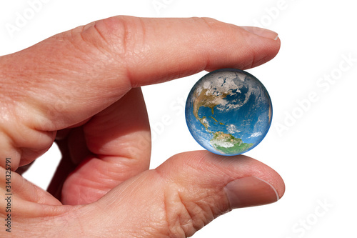 Fototapeta Naklejka Na Ścianę i Meble -  The Earth globe held between index finger and thumb. The earth pinced between two fingers. Evironmental concept. Close up image isolated on white background. Elements of this image furnished by NASA