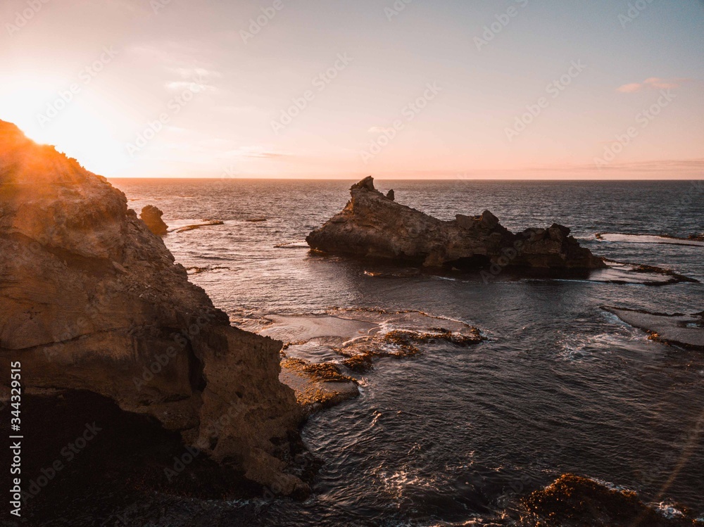 cold sunrise over ocean cliffs