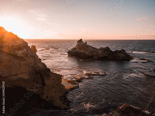 cold sunrise over ocean cliffs