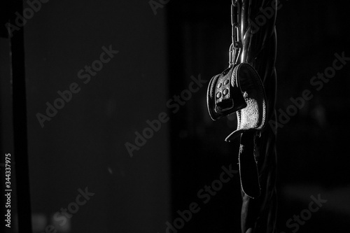 BDSM Leather handcuffs for role-playing games on a black background. Bondage for carnal pleasures. Domination and submission.