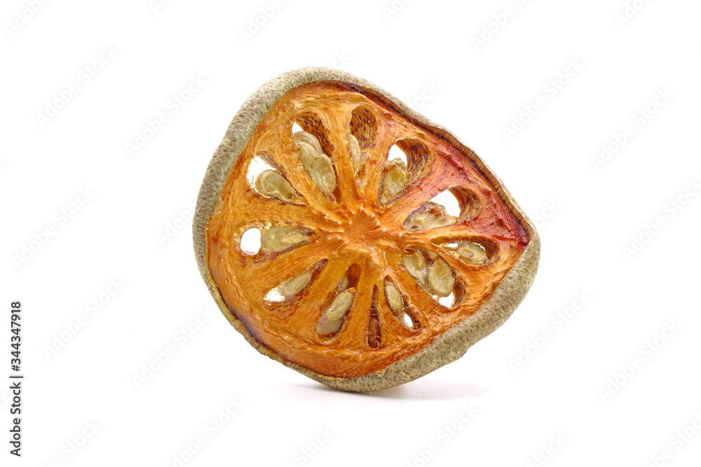 Dried sliced Bael fruit isolated on white background. Bael fruit has anti-inflammatory property, helps to heal digestive disorders, used as a remedy for asthma, and common cold. Herbal tea ingredients Dried sliced Bael fruit isolated on white background. Bael fruit has anti-inflammatory property, helps to heal digestive disorders, used as a remedy for asthma, and common cold. Herbal tea ingredients