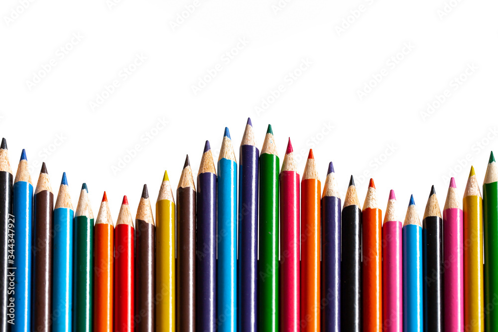 Multi-coloured colouring pencils isolated on white background with copy space Multi-coloured colouring pencils isolated on white background with copy space