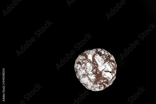 One Chocolate Chip cookies on black background with copy space