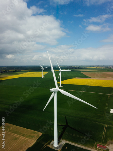 Photo a white windmill that generates electricity in France in the summer