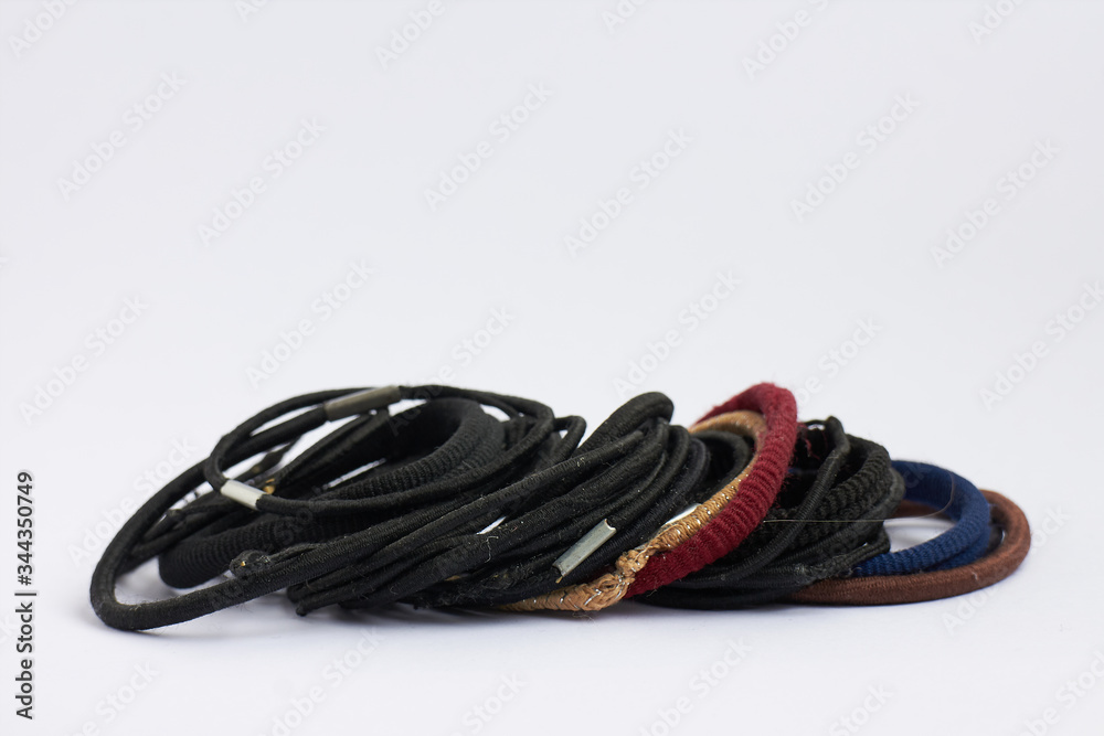 various hair bands stacked on white background various hair bands stacked on white background