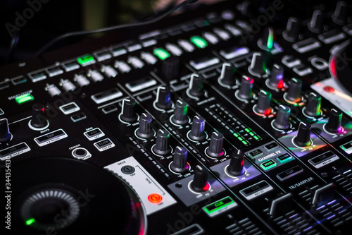 Blurred TRS sequencer section on DJ Controller with mixer section © FunGuy Photos Videos
