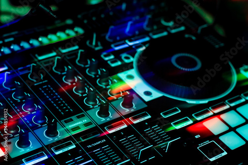All in one Mobile DJ Controller Showing one deck & Mixer Section With Buttons, Sliders & Knobs