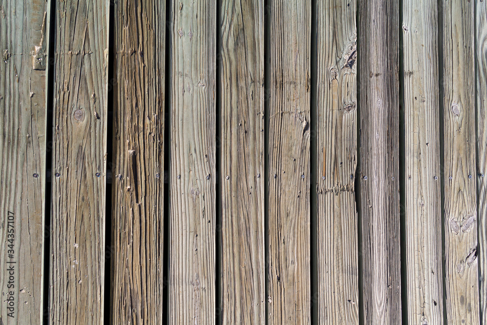 Obraz premium weathered wooden planks of seaside dock for background and texture
