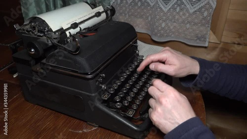 Closeup view of typing text typewriter and carriage return mans hands russian