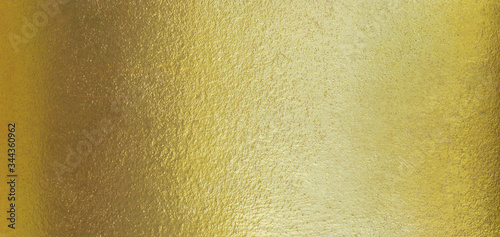 Gold texture background with yellow luxury shiny shine glitter sparkle of bright light reflection on golden surface