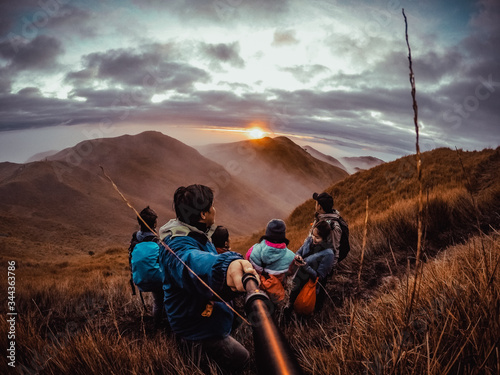 hikers in the mountains witnessing sunrise in Mt. Pulag in the Philippines. photo
