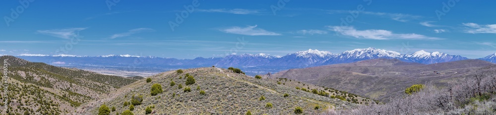 Views of Wasatch Front Rocky Mountains from the Oquirrh Mountains in early spring, Hiking in Yellow Fork trail and Rose Canyon in Great Salt Lake Valley. Utah, United States. USA. Views of Wasatch Front Rocky Mountains from the Oquirrh Mountains in early spring, Hiking in Yellow Fork trail and Rose Canyon in Great Salt Lake Valley. Utah, United States. USA.