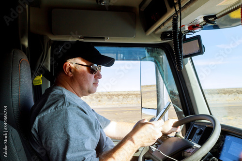 Truck drivers big truck driver's in cabin of big modern truck