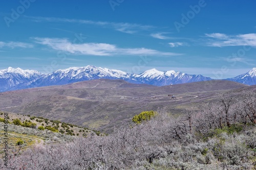 Views of Wasatch Front Rocky Mountains from the Oquirrh Mountains in early spring  Hiking in Yellow Fork trail and Rose Canyon in Great Salt Lake Valley. Utah  United States. USA.