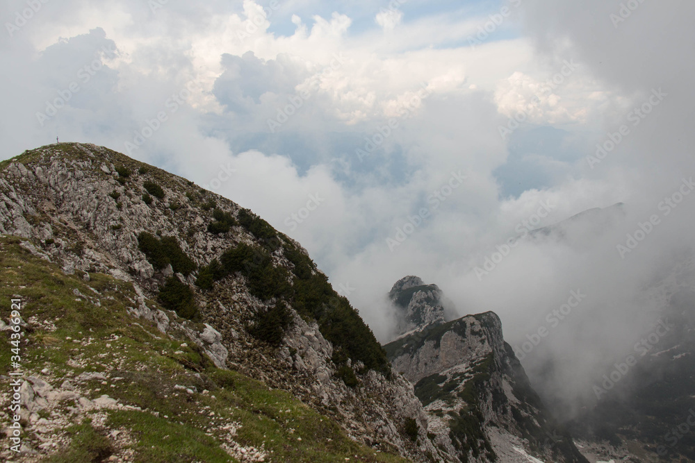 Panoramic view from Rifugio Telegrafo on mountains in a cloudy day.